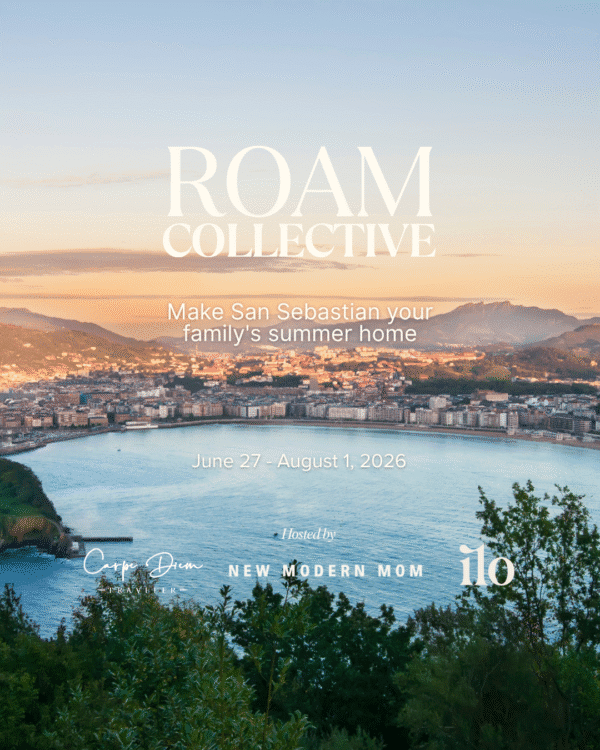 Scenic view of San Sebastian bay at sunset with Roam Collective event details, June 27 - August 1, 2026.